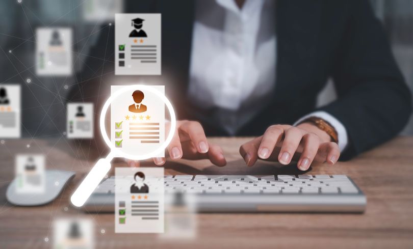 HR manager using a computer to search and select job applicants