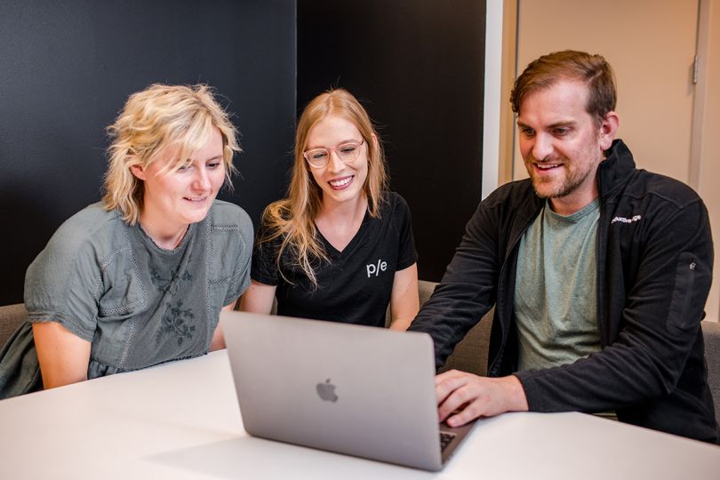 Productive Edge team members working on a project together
