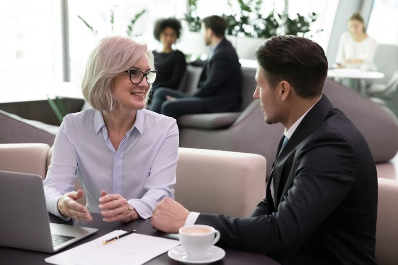 A businessman consulting with a client