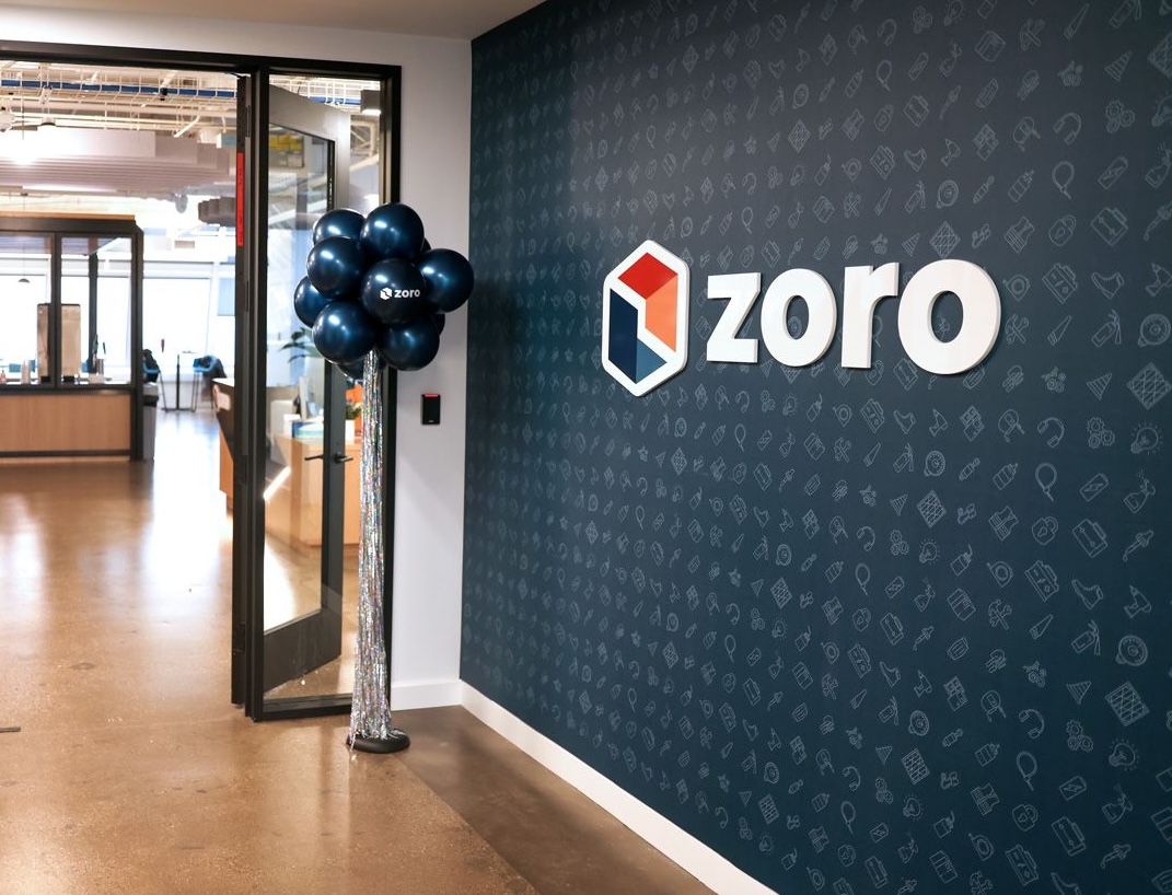  Zoro logo on wall leading to office entryway, with branded balloons next to the door.