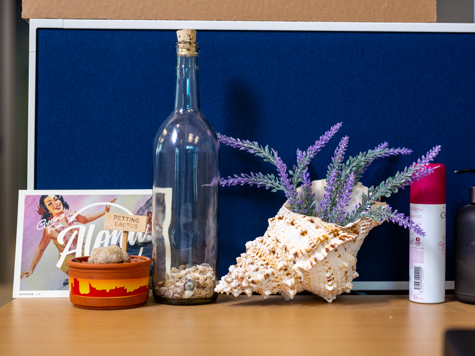 A desk at the Bento office with a conch shell.