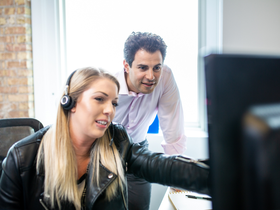 Jared Kaplan speaks with employees