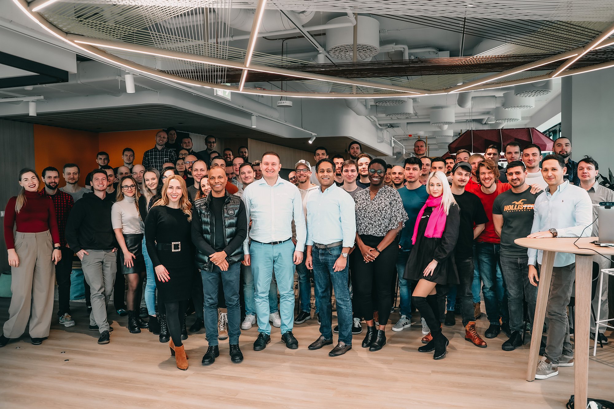 Large group photo of GoHealth employees in the office