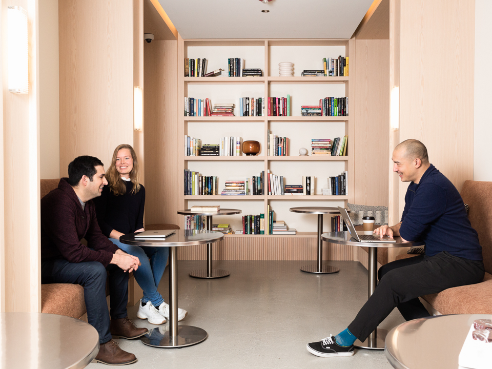 Adyen team members gathered in library-like area of office 