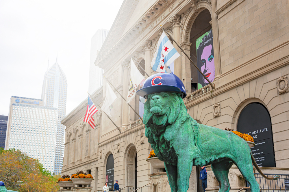 A Chicago monument wearing a Chicago Cubs helmet. 