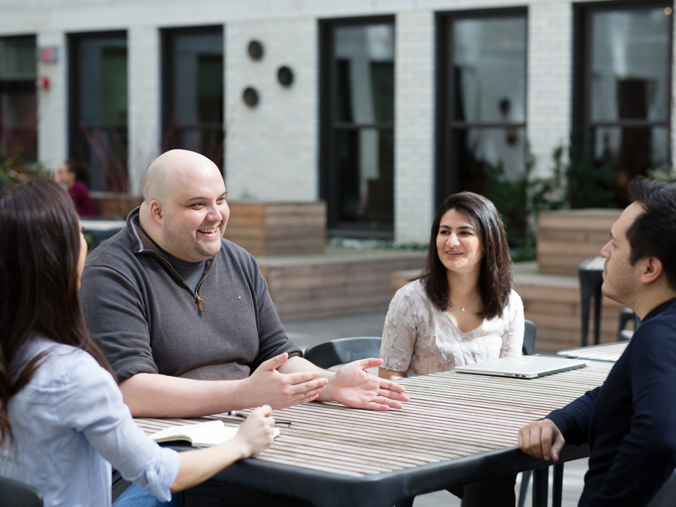 VillageMD's Britain Cox chatting with staff