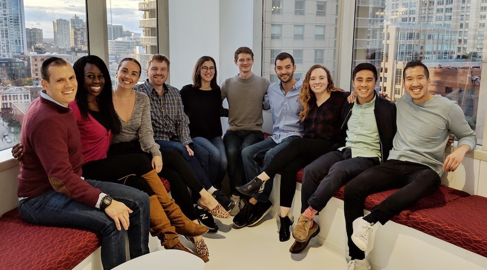 CancerIQ team pictured seated in front of window