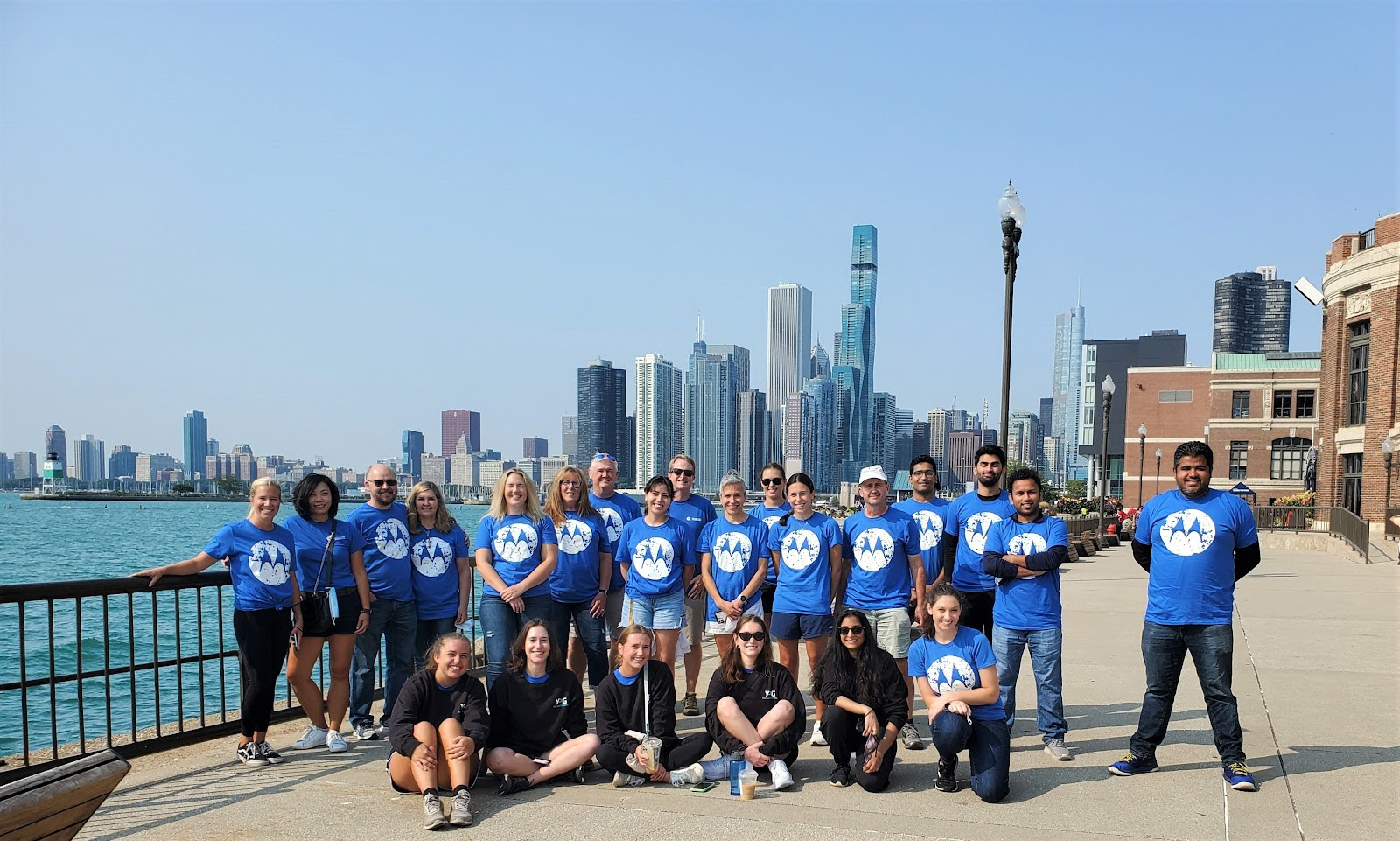 Motorola team posing in front of Chicago skyline