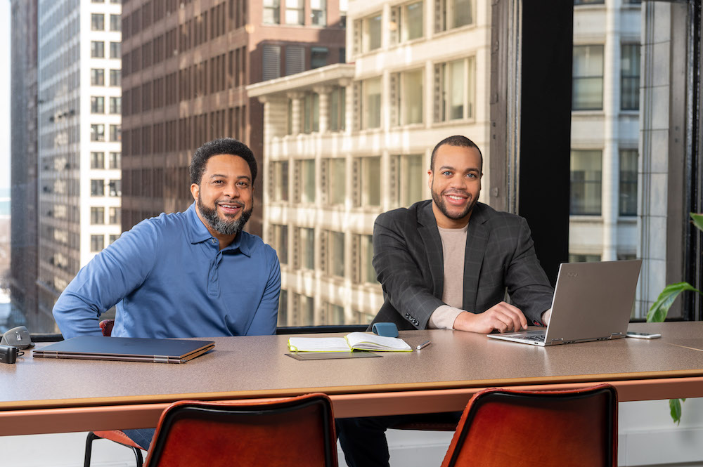 Clinify Health co-founders sitting at a table together