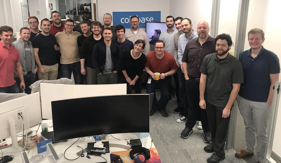 Coinbase team in their office posing for photo