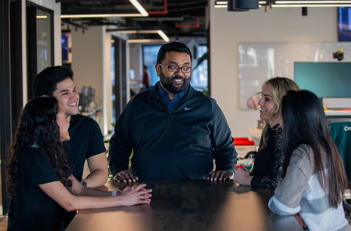 Devbridge manager having a meeting with his team