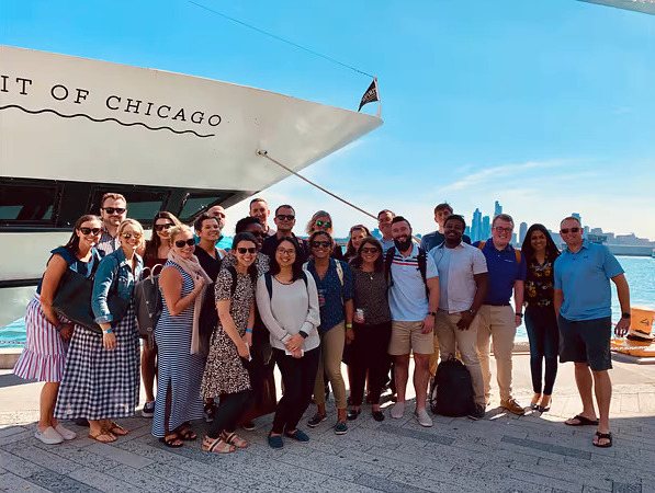 A group of Elevate employees during a team outing on a boat at Lake Michigan.