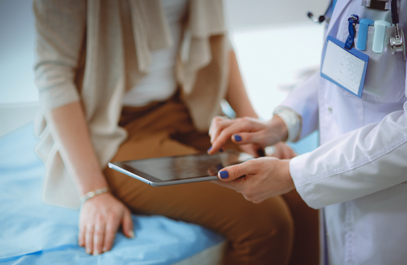 Doctor speaking with a patient in doctor's office