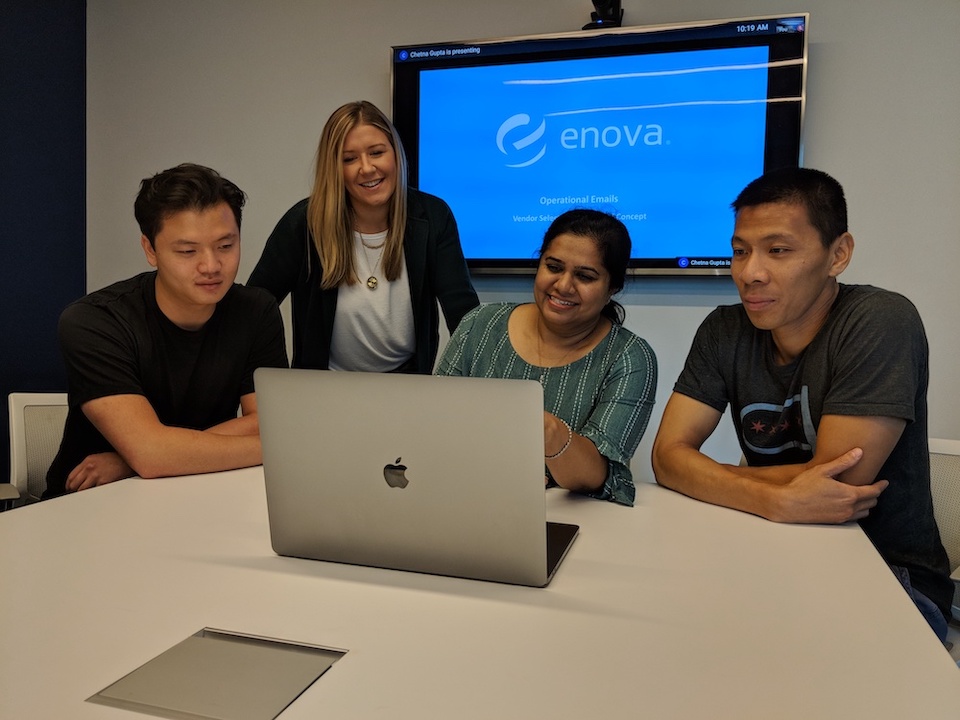 Enova team working at one computer