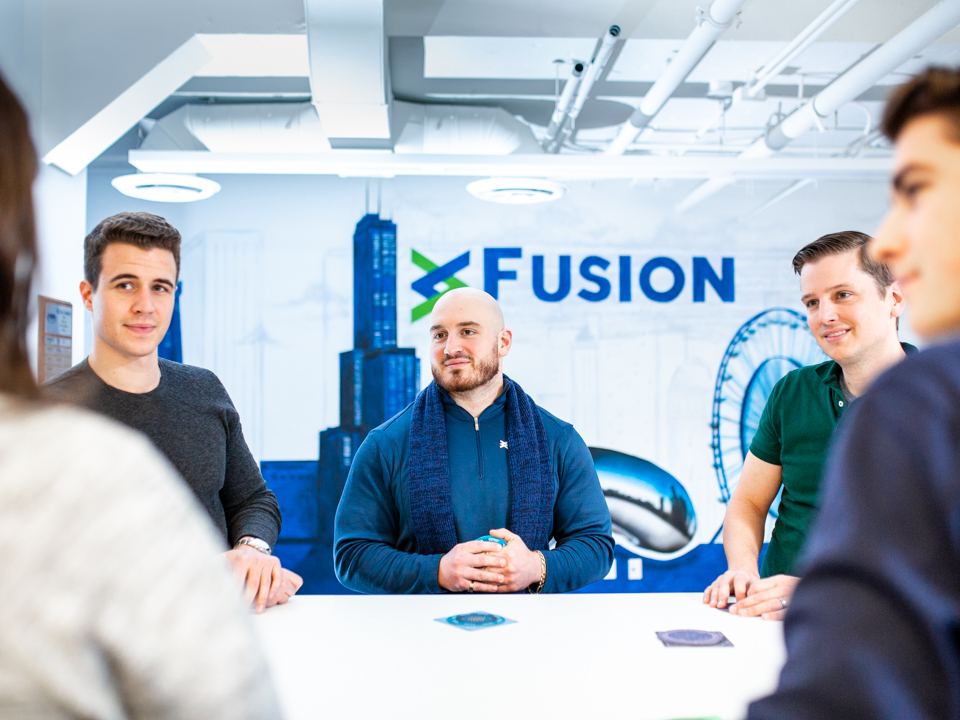 Fusion Risk Management staff chatting in their office