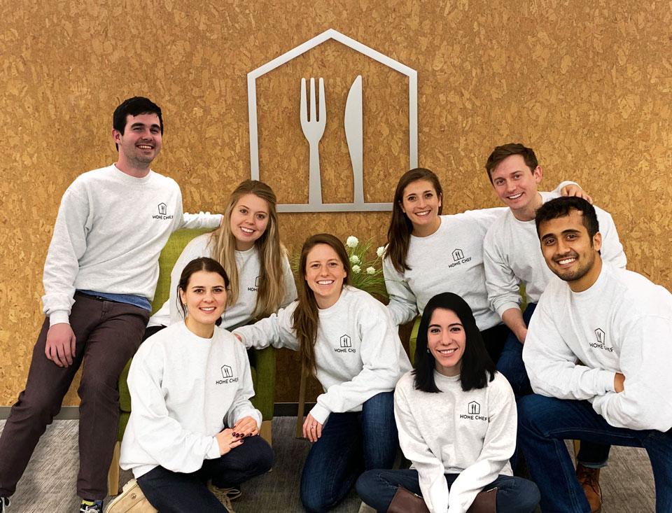 Home Chef staff posing in matching sweaters for group photo