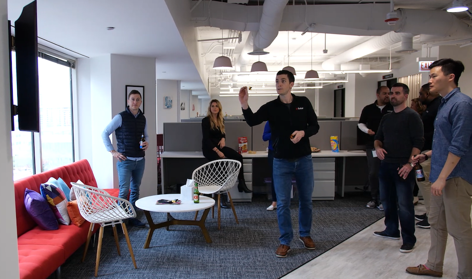 Infutor Data Solutions team playing darts in their office