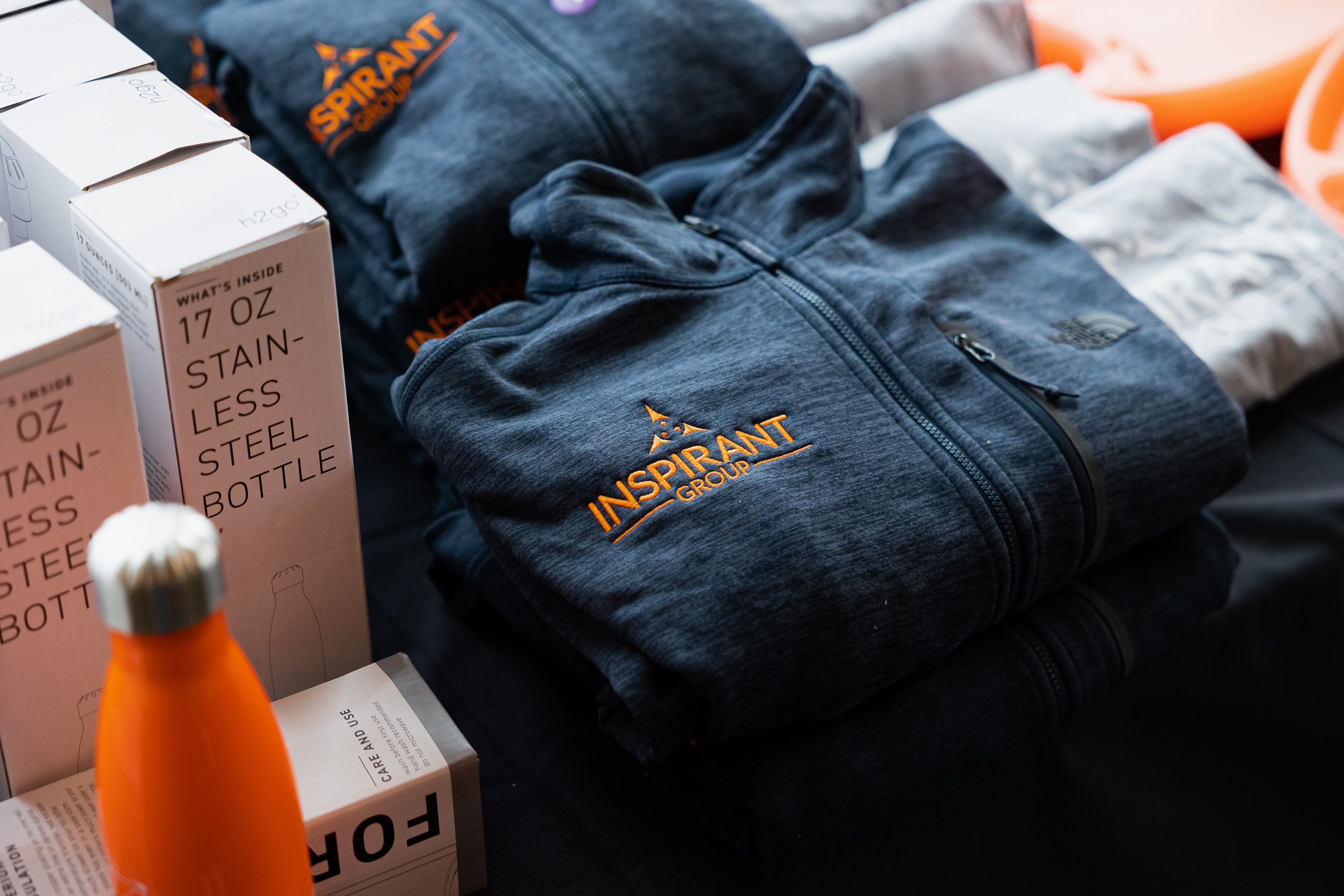 Inspirant's retreat swag with water bottles, apparel and more