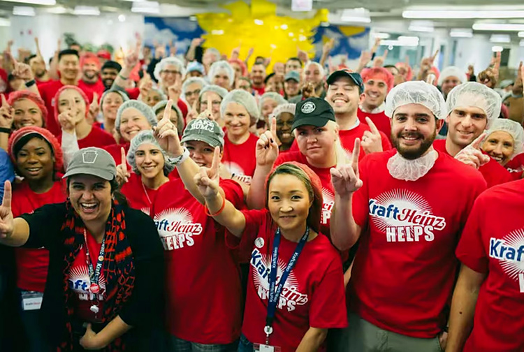 Kraft Heinz Company group photo with team members wearing matching red t-shirts with the company logo on them