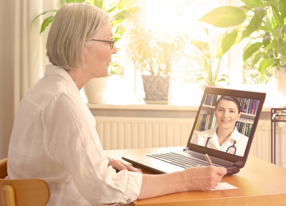 Woman speaks to doctor on video chat