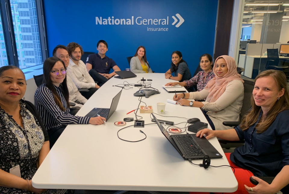 National General Insurance team members smiling in a conference room