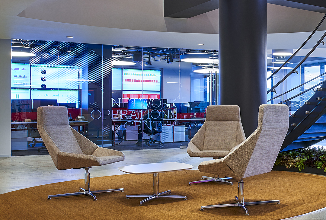 photo of one of Boingo Wireless' network operating center and its lobby, with three chairs and a table.