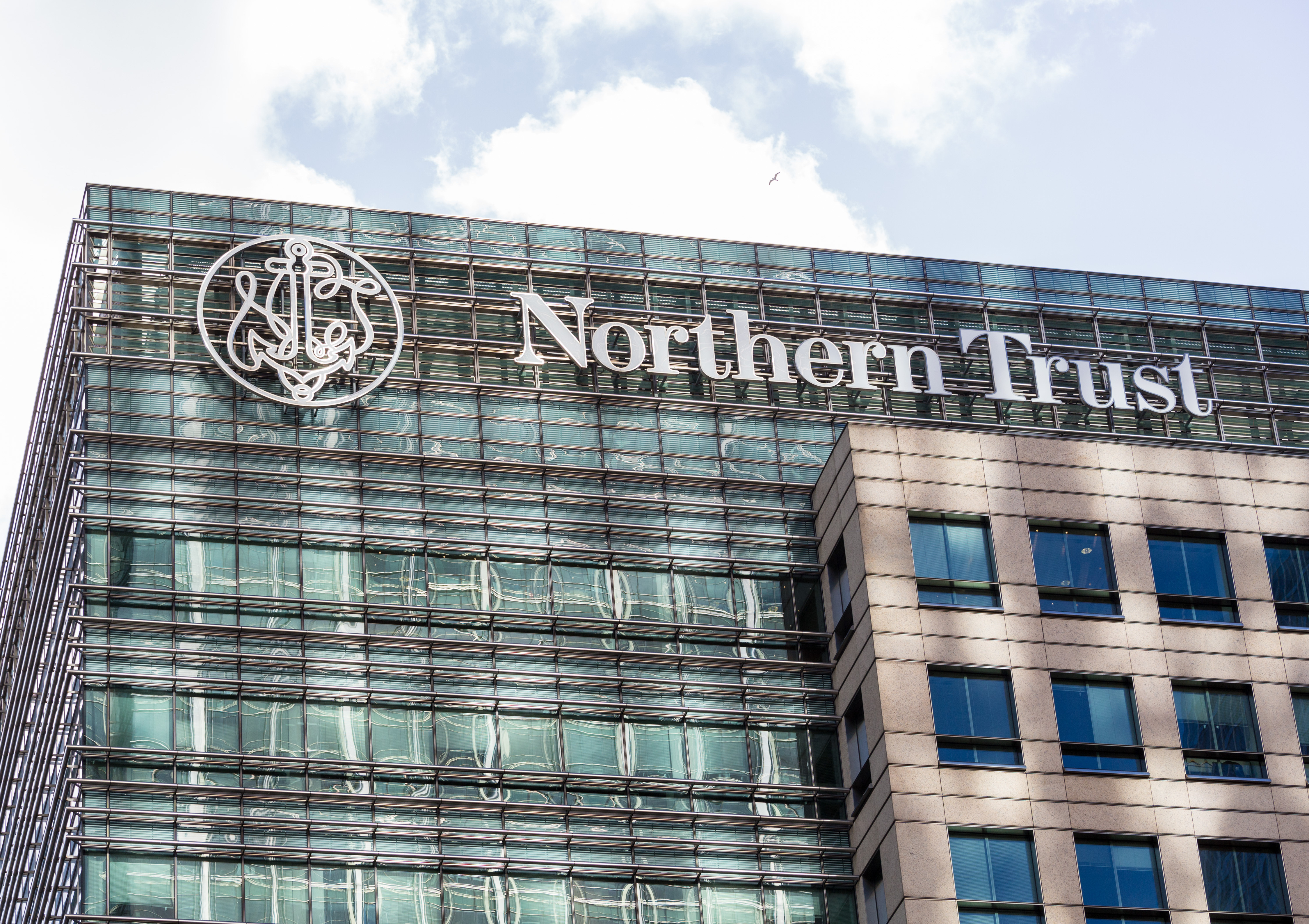 The facade of a Northern Trust office with the company's name and logo