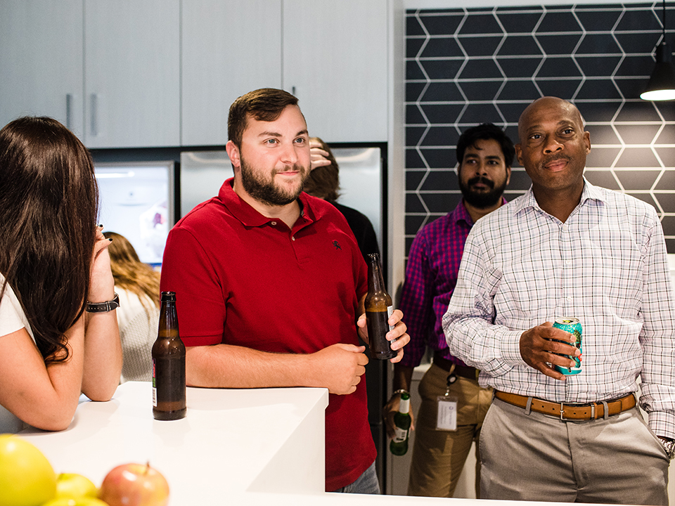 Employees enjoy beer in the OneSpan kitchen