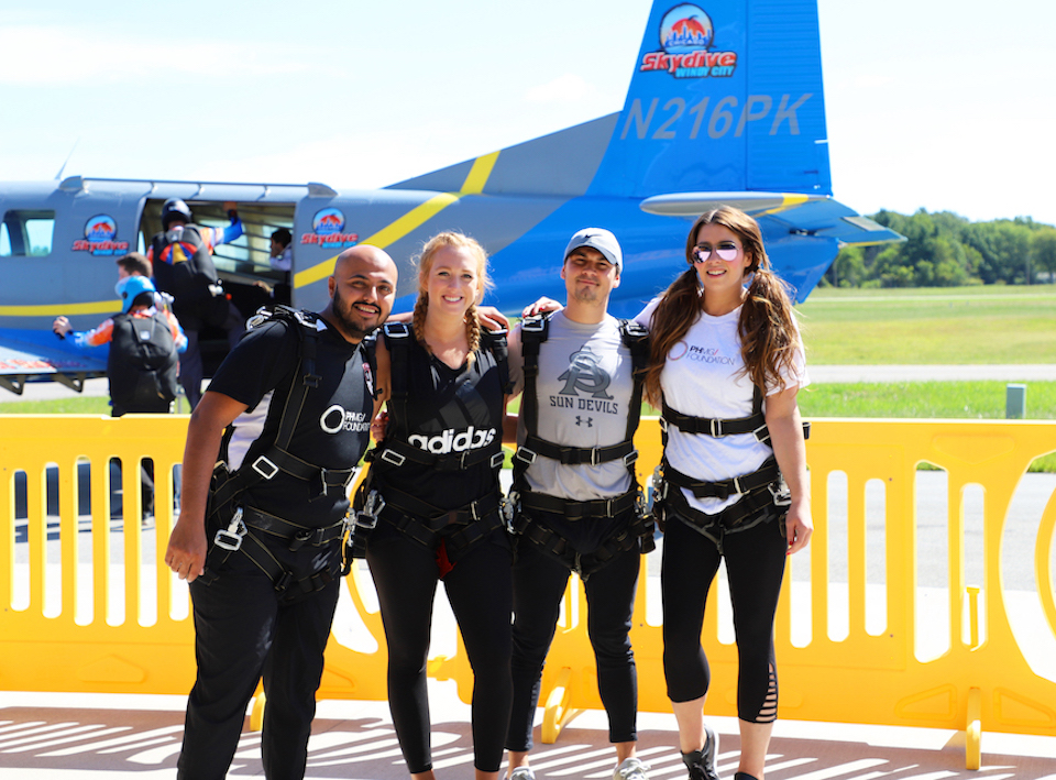 PHMG team members at skydiving outing