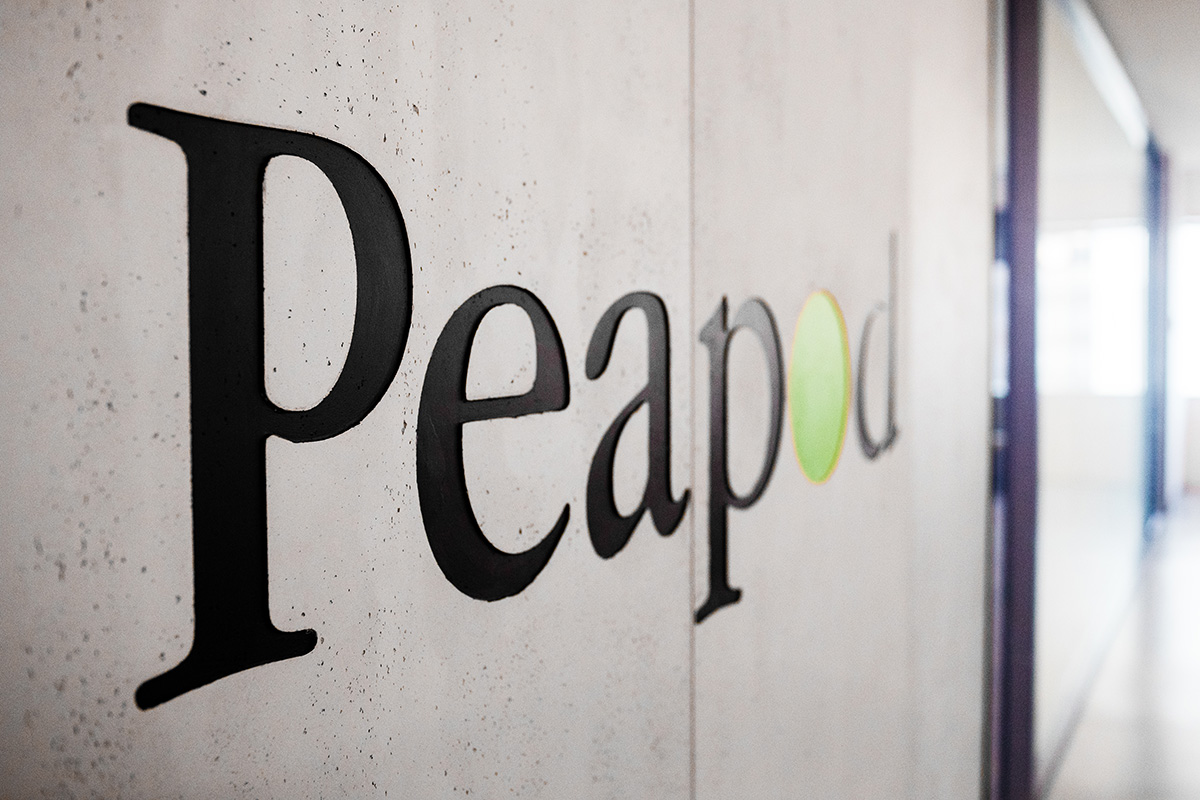 Close up of the Peapod logo on the wall in the office