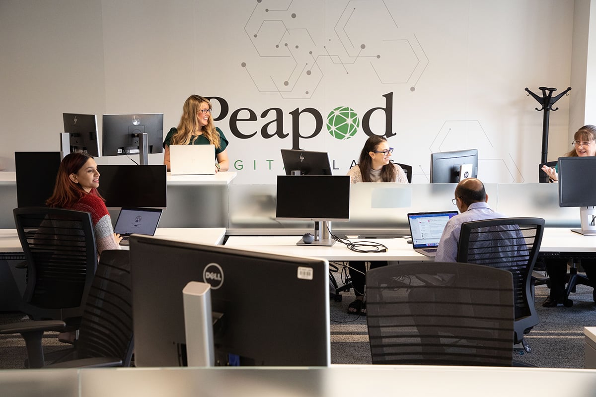 Team members working in the Peapod Digital Labs office
