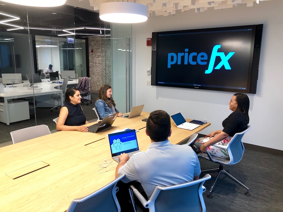 Pricefx team members working in a conference room