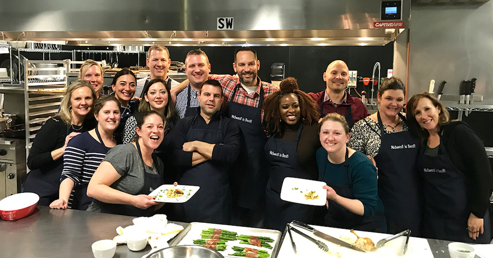 Rewards Network team at outing in chef's kitchen