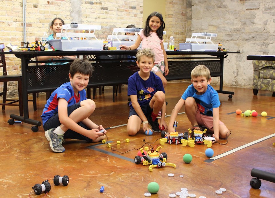 Kids using RoboThink mechanical parts