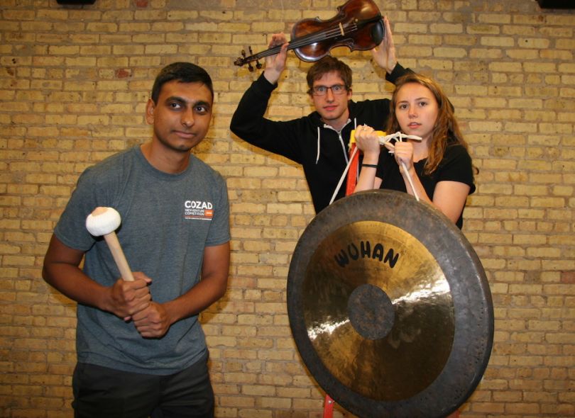 Trala team members posing with musical instruments