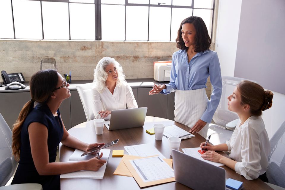 Tribune Publishing: stock photo of professional women chatting