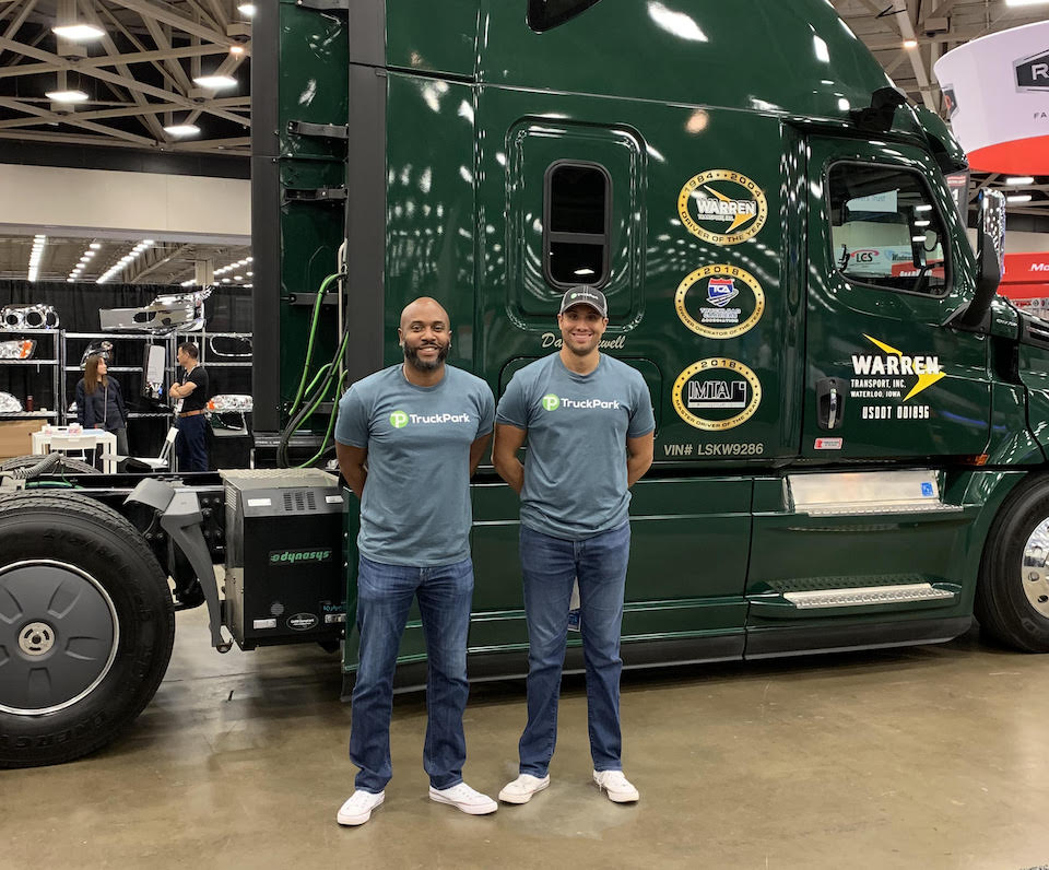 TruckPark staff in front of big rig