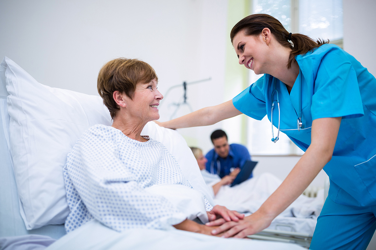 Nurse consoling a patient at a hospital