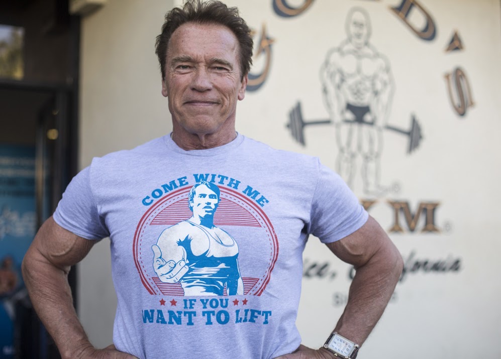 Arnold Schwarzenegger wearing his celebrity merch