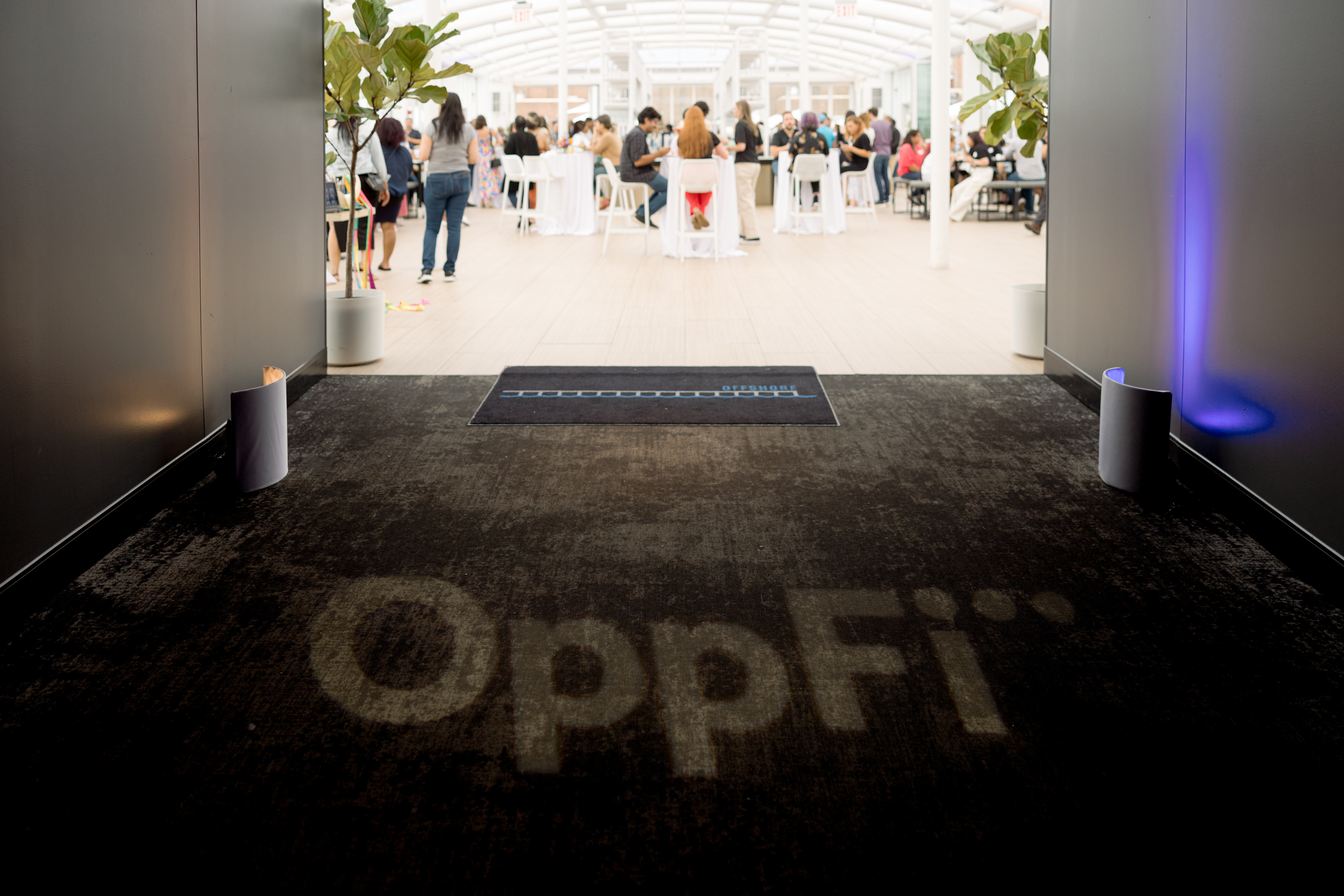 Branded entry lighting reads “OppFi” leading into Thrive Where You Work Week at Navy Pier’s Offshore Rooftop venue.