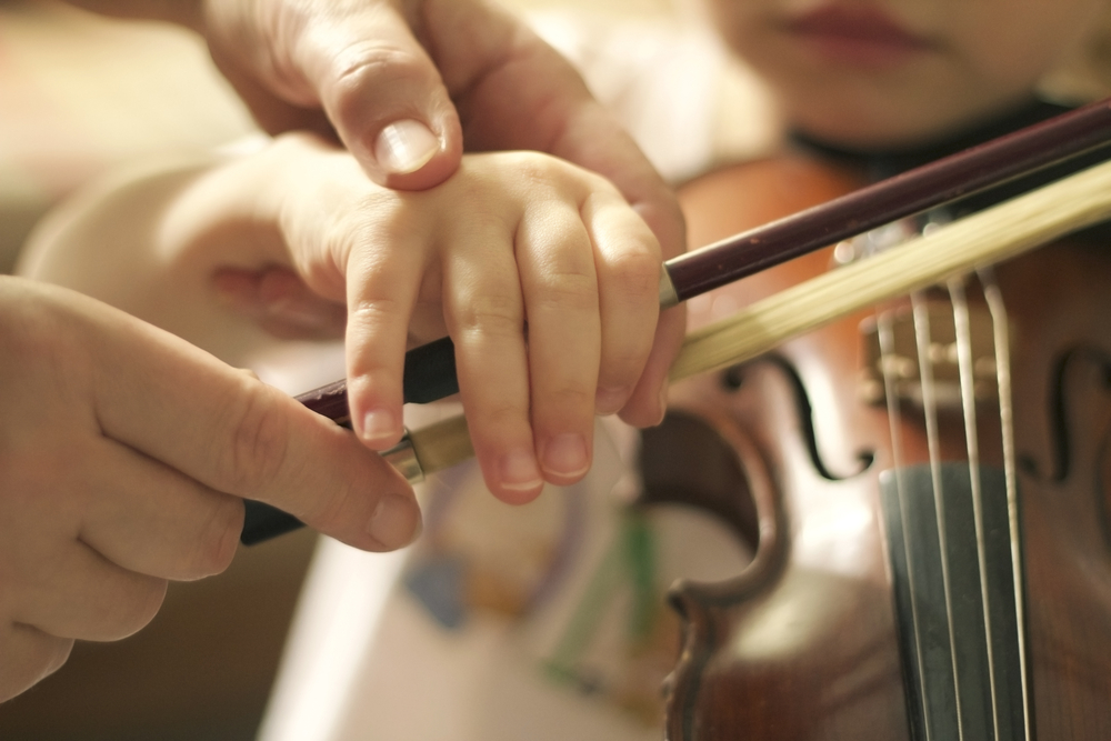 Violin teacher with student