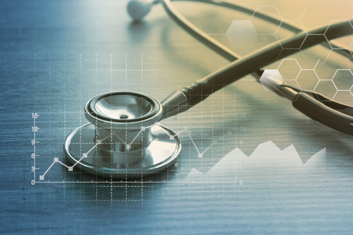  A stethoscope over a digital graph background, representing the intersection of healthcare and data analytics.
