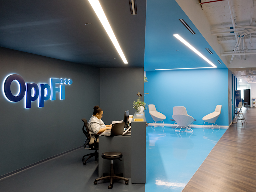 Person sitting at a desk at the OppFi office