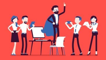 Office workers celebrate a peer who is wearing a cape and standing on a chair in a super hero pose — illustrated image