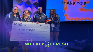 Reach Pathways holding a $4,000 check after wining the SXSW Pitch competition.