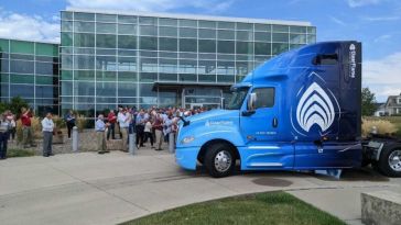 A ClearFlame Engine Technologies truck in front of a building. 