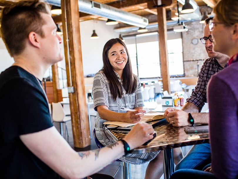 Natalie Yee laughs with coworkers
